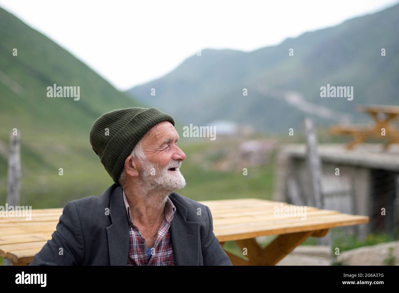 Rize, TURKEY - July 31, 2015: Avusor or Avusör is a plateau in the Çamlıhemşin district of Rize province. Old man sitting in front of his house in the Stock Photo