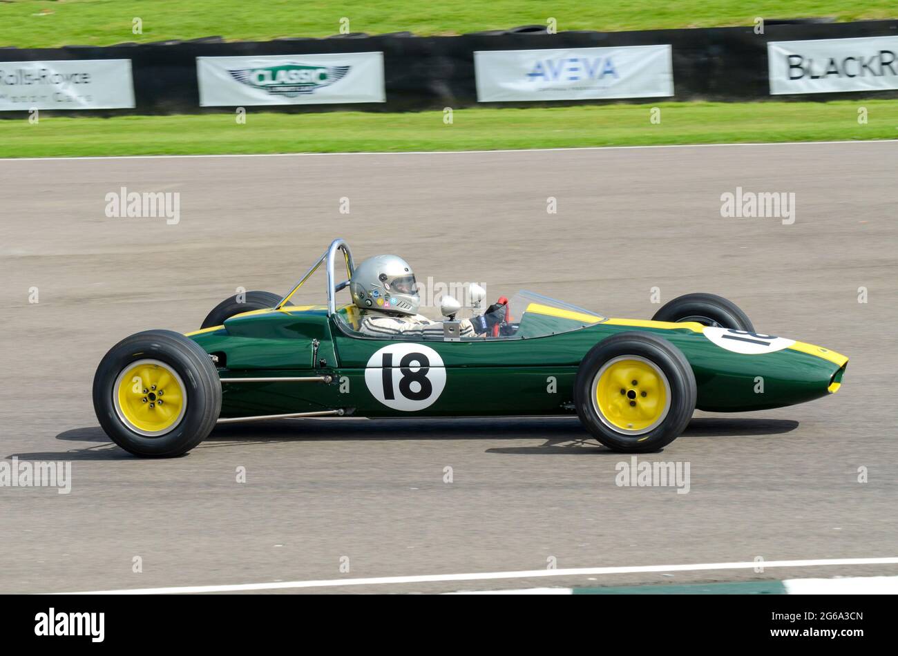 Lotus Ford 27 classic Formula Junior vintage racing car competing in the Chichester Cup at the Goodwood Revival historic event, UK. Driver Chris Locke Stock Photo
