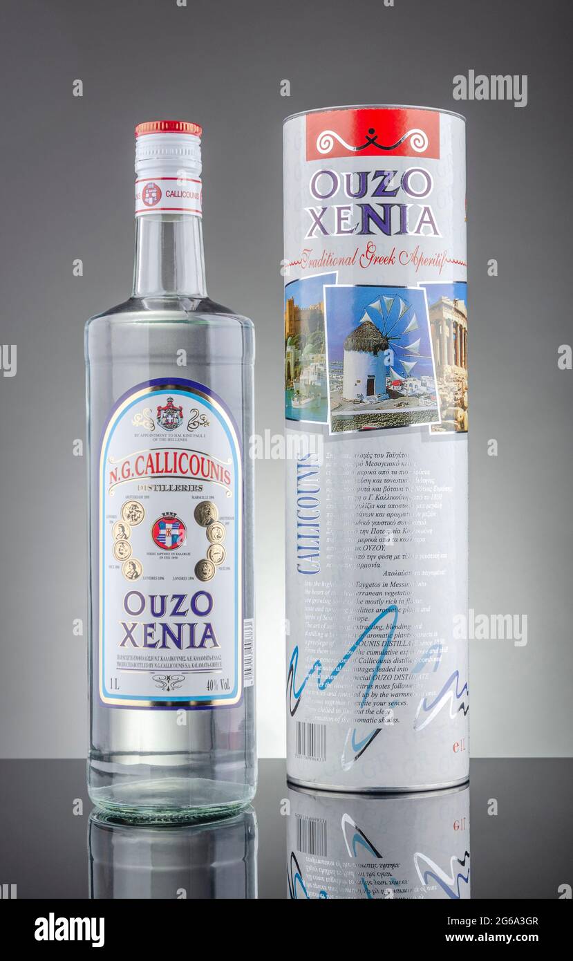 Bottle of Xenia ouzo isolated on gradient background. Ouzo is dry anise