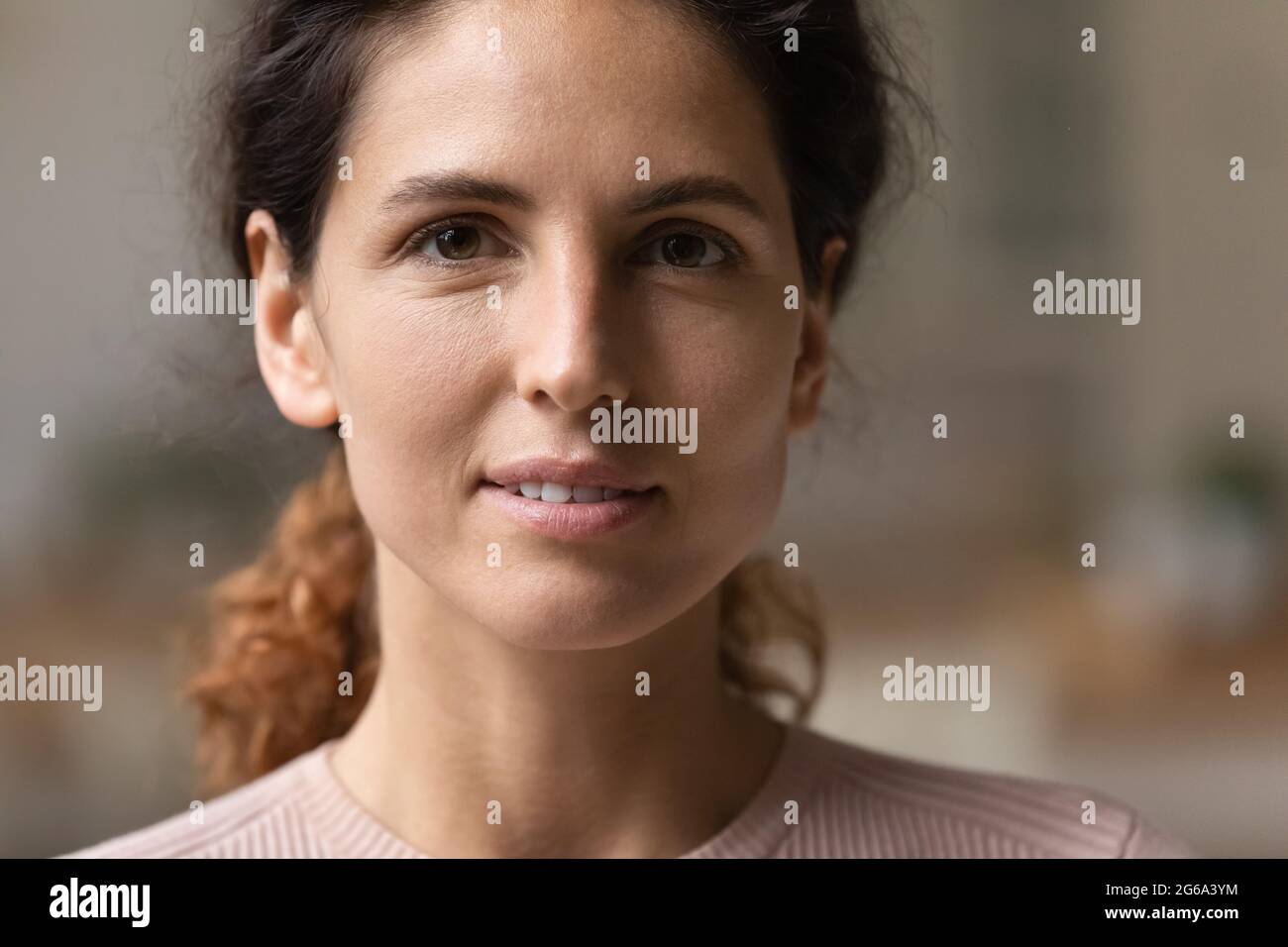 Happy attractive young 30s authentic woman looking at camera Stock