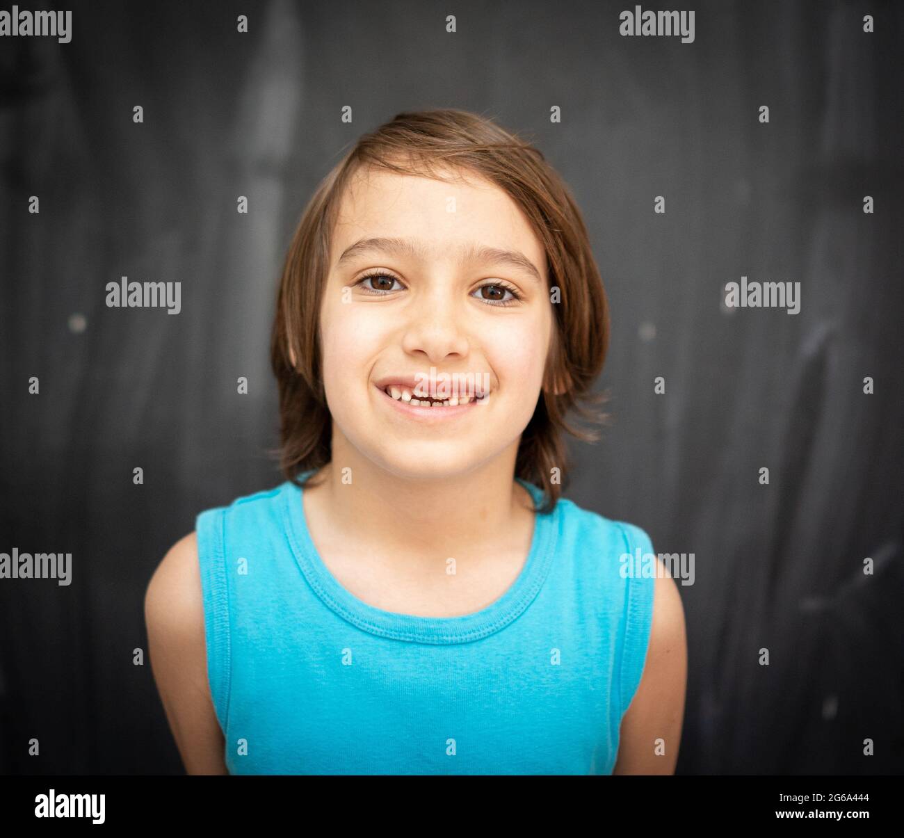 Little cute boy in front of classroom chalkboard Stock Photo - Alamy