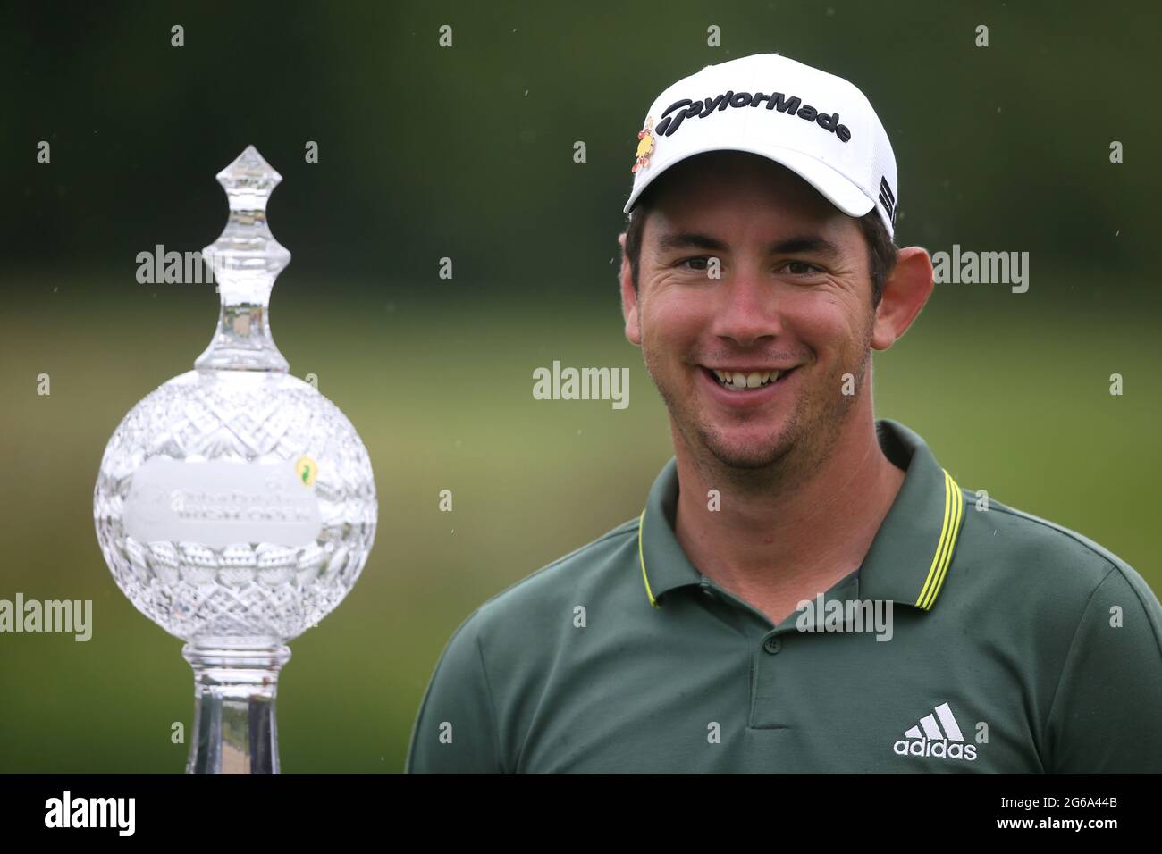 Lucas Herbert celebrates with the trophy after winning the Dubai Duty