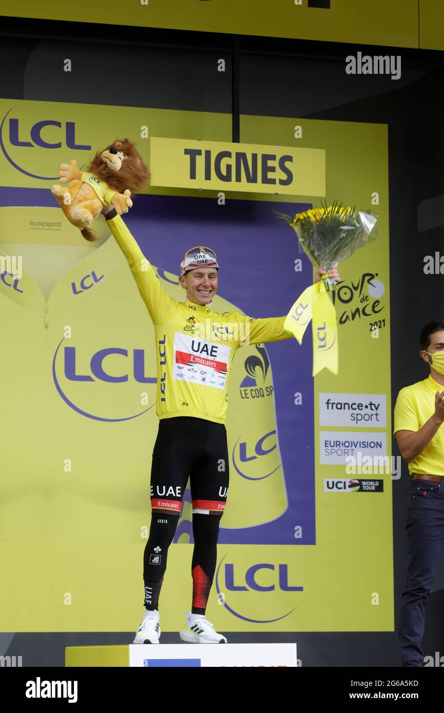 Tignes, France. 04 July 2021. Tadej Pogacar wearing the Maillot Jaune on the podium of the 9th stag of the Tour de France. Julian Elliott News Photography Credit: Julian Elliott/Alamy Live News Stock Photo