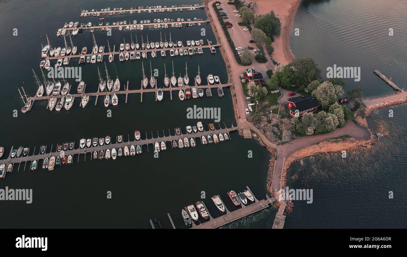 Aerial top view of a lot of white yachts and sailboats moored in a ...