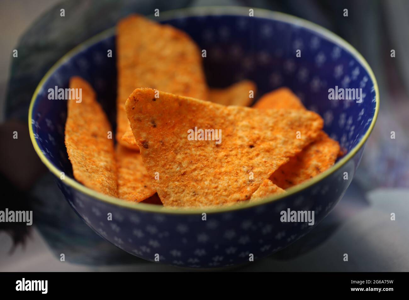 Snack Foods Concept Closeup of spicy flavoured crisp snacks in a