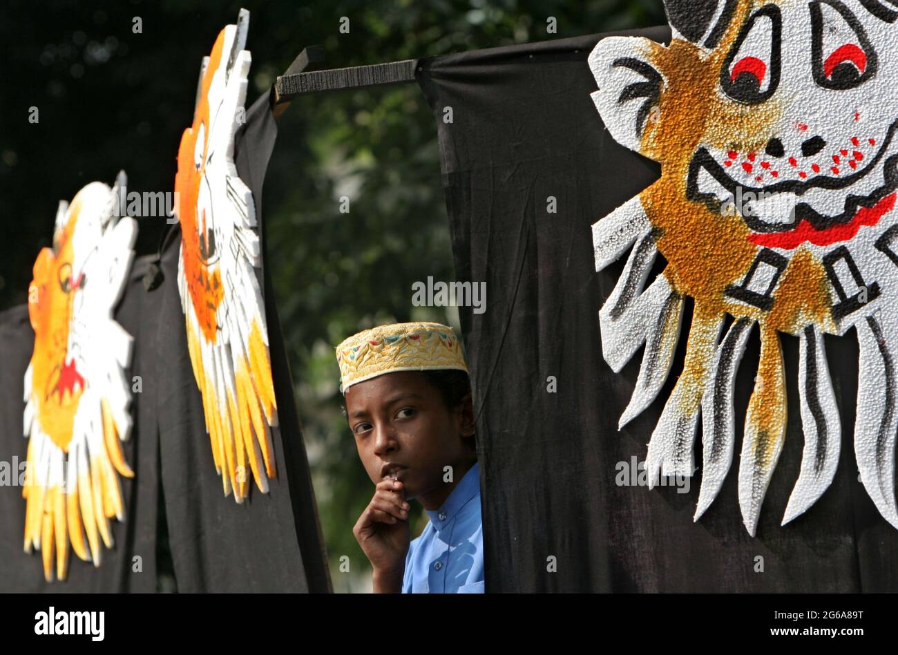 Bangladeshi boy  stand with symbolic banners of the war criminals of the Liberation war in 1971 against Pakistan, during the victory day at the central Shaheed Minar, Dhaka, Bangladesh 16 December 2007. The whole nation celebrates the 36th Bangladeshi boy stands with symbolic banners of the Liberation war criminals during the victory day at the central Shaheed Minar, Dhaka, Bangladesh. December 16, 2007. The whole nation celebrates the 36th victory anniversary over Pakistani occupation forces with the demand for trial of the war criminals across the country. Stock Photo