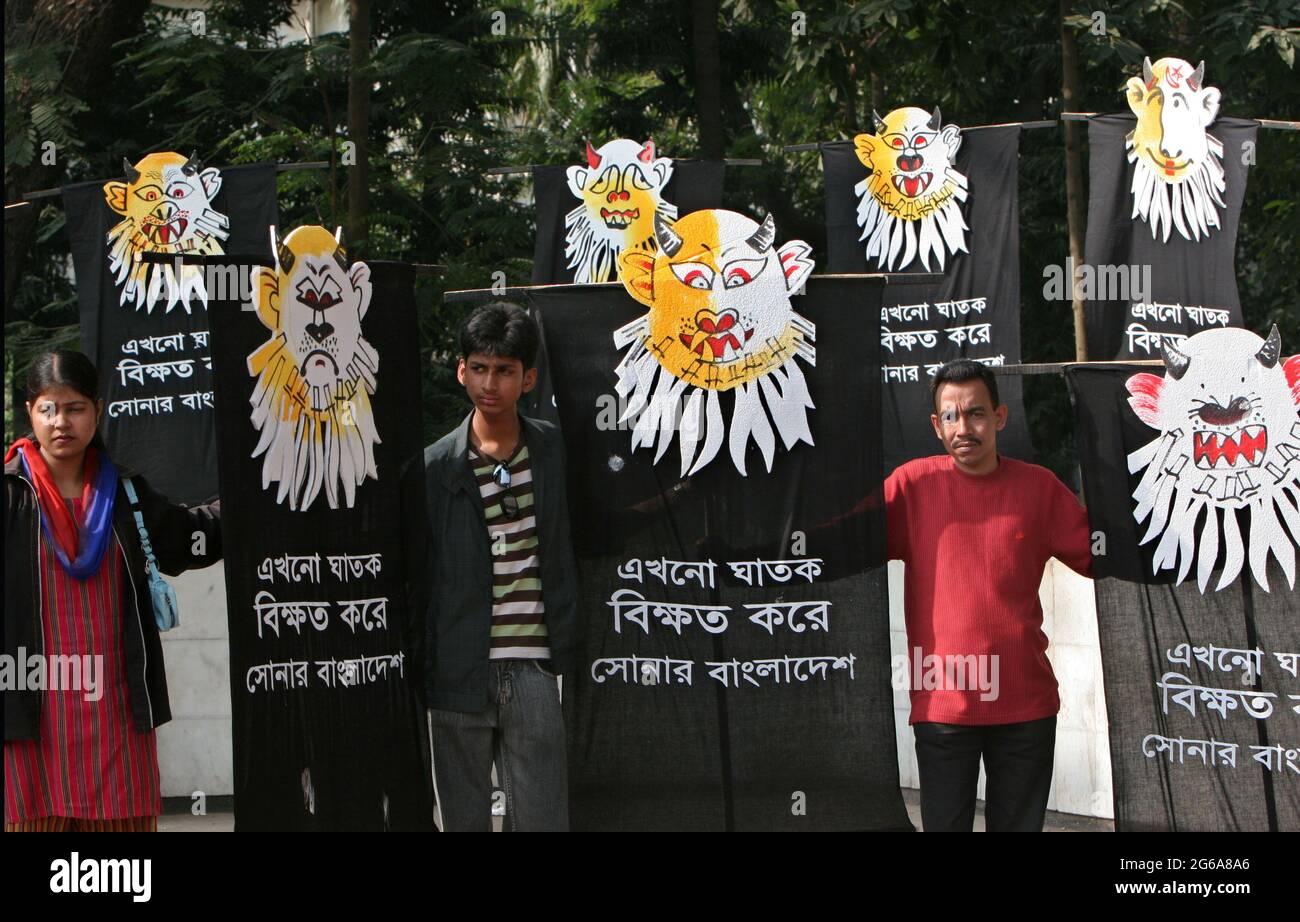 Bangladeshi cultural activist stands with symbolic banners of the Liberation war criminals during the victory day at the central Shaheed Minar, Dhaka, Bangladesh. December 16, 2007. The whole nation celebrates the 36th victory anniversary over Pakistani occupation forces with the demand for trial of the war criminals across the country. Stock Photo