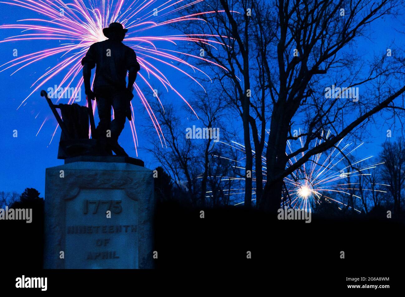 Fireworks going off behind Minuteman statue at the Old North Bridge, in Concord, Massachusetts (photoshop). Stock Photo