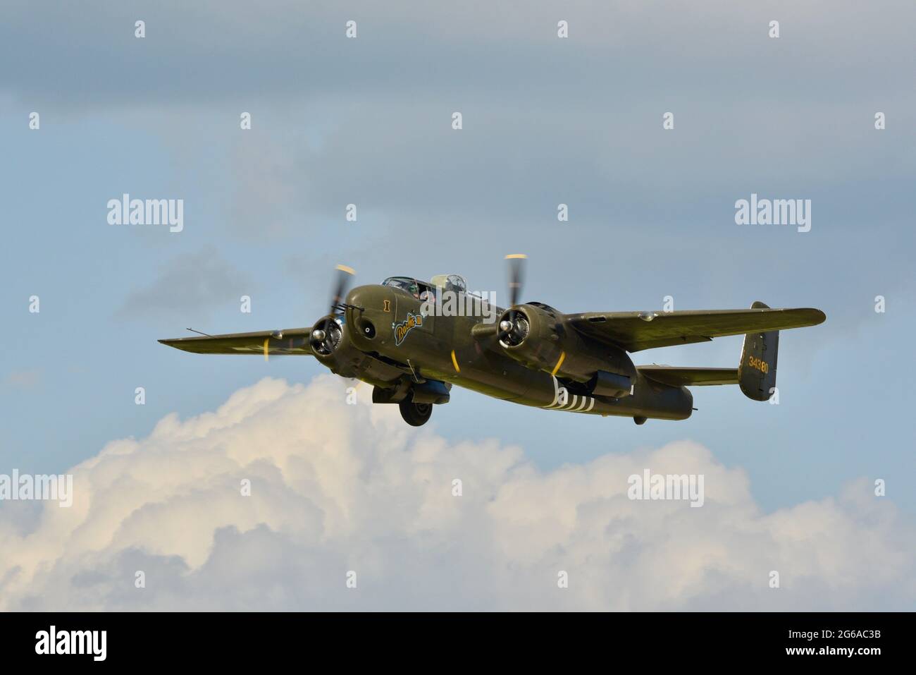 Second World War B-25H Mitchell bomber, 'Barbie 3,' airborne and making bombing runs at the EAA Fly-In (AirVenture), Oshkosh, Wisconsin, USA Stock Photo