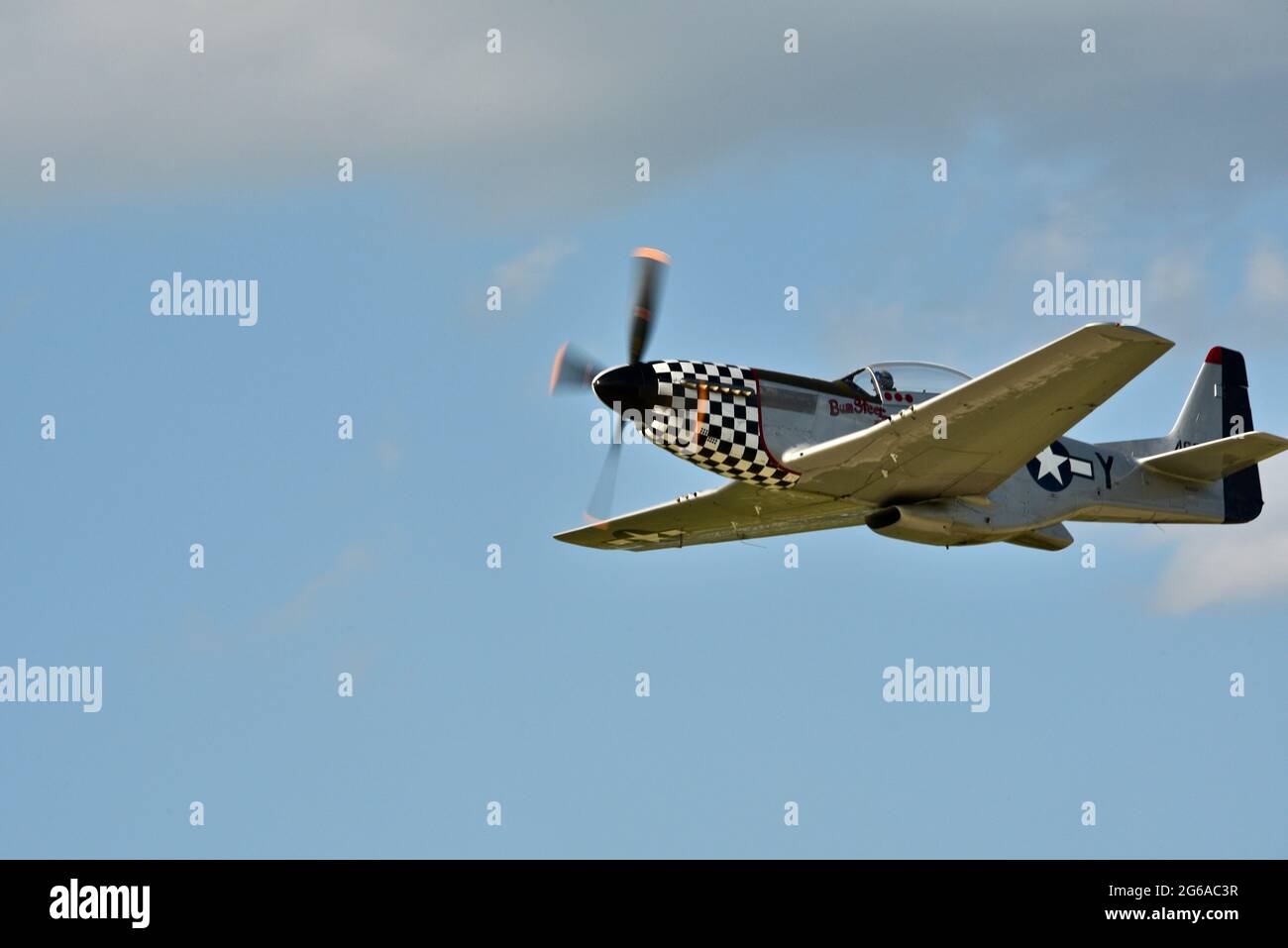 Second World War P-51 Mustang airborne and making high speed passes at the EAA Fly-In (AirVenture), Oshkosh, Wisconsin, USA Stock Photo