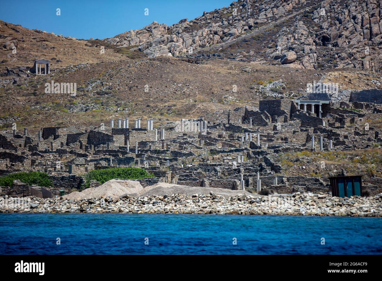 Greece. Delos the sacred Cyclades island, general view from the sea. Ancient civilization seaside ruins, archaeological site on UNESCO World Heritage Stock Photo