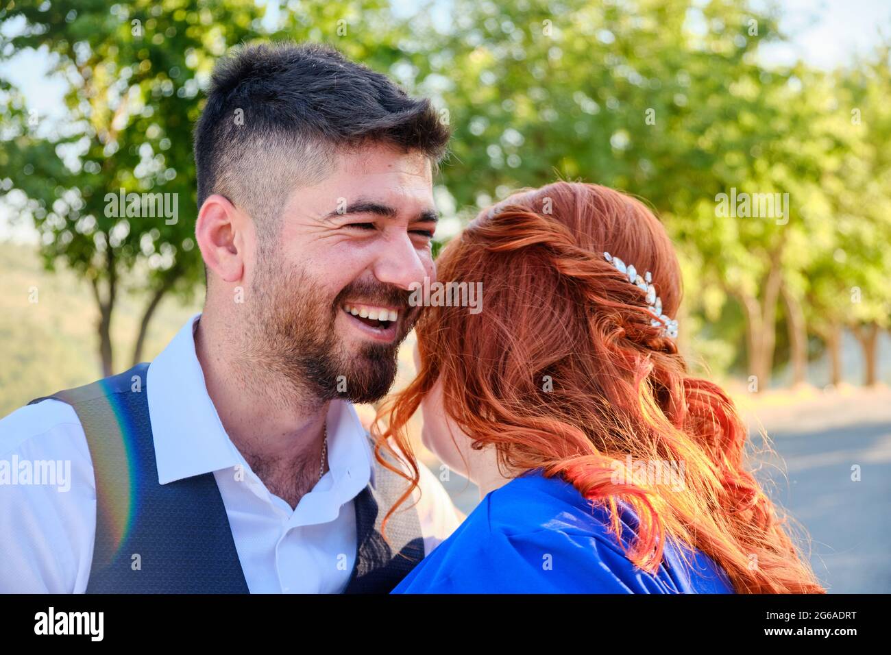 Man hugs his beloved woman smiling Stock Photo