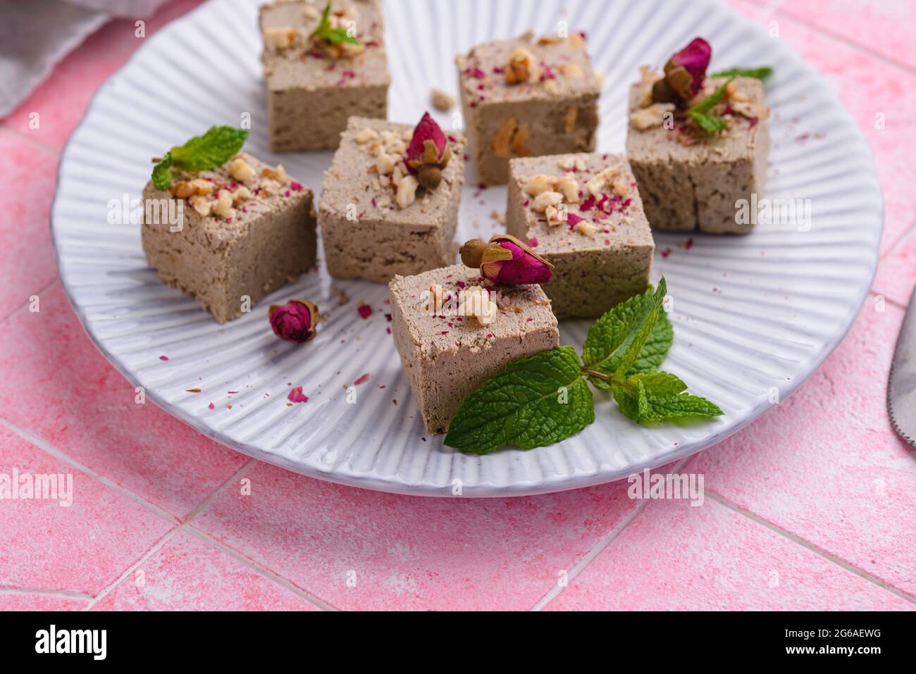 Halva with rose petal and nuts Stock Photo Alamy