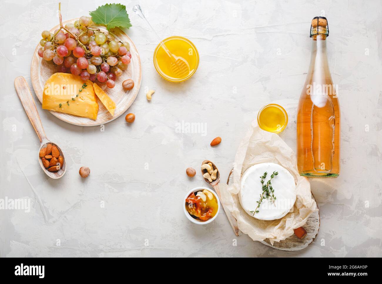 Rose champagne pink wine or apple cider bottle with appetizer set