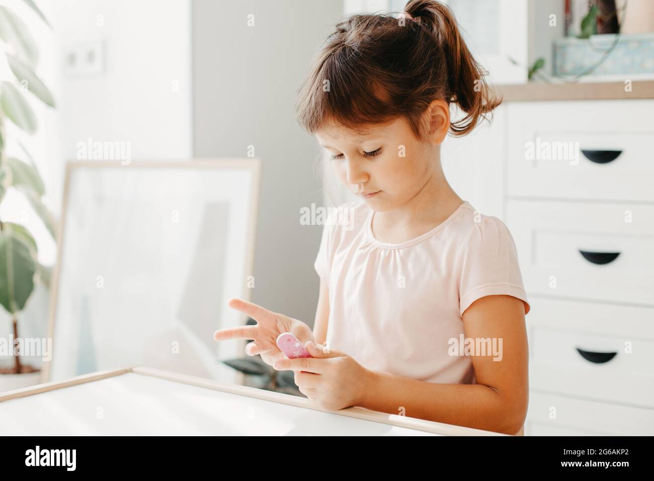 Child using nail brush hi-res stock photography and images - Alamy