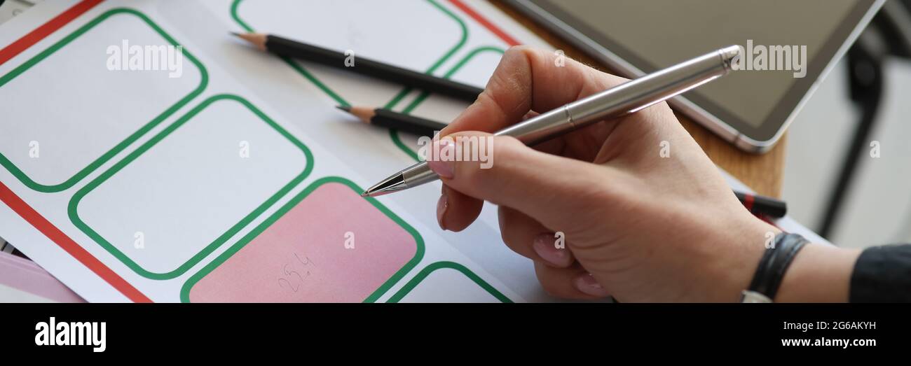 Woman's hand puts mark in cadastral, map Stock Photo
