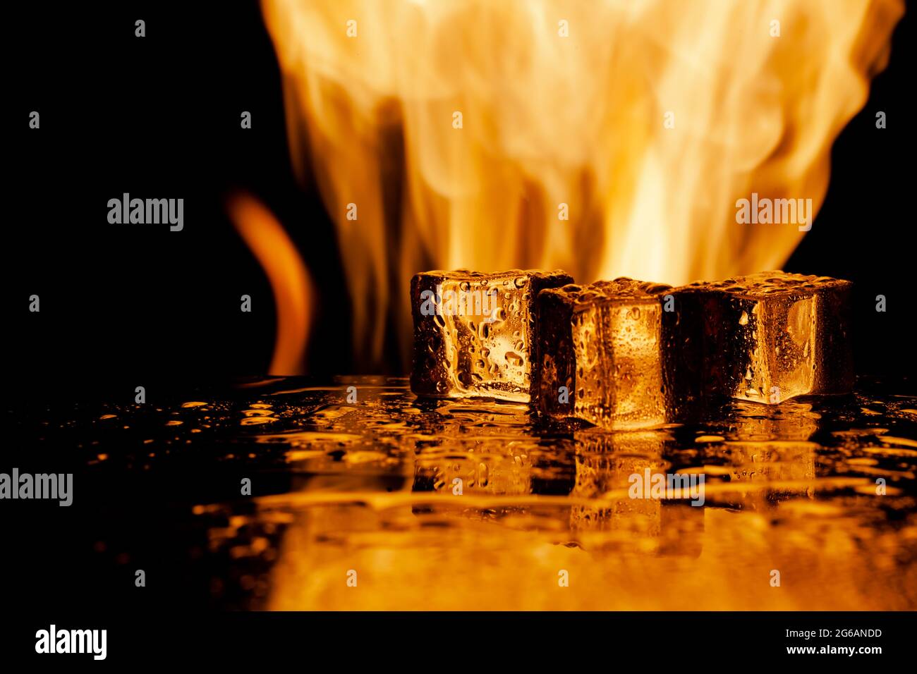 fire and ice, ice cubes and flames, black background Stock Photo - Alamy