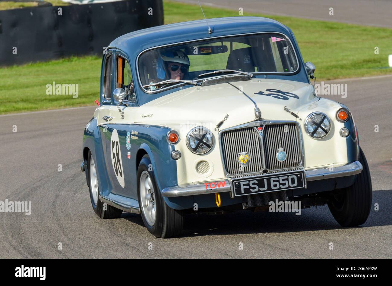 Rover 100 P4 classic saloon, vintage racing car competing in the St Marys Trophy at the Goodwood Revival historic event, UK. Cornering. Female driver Stock Photo
