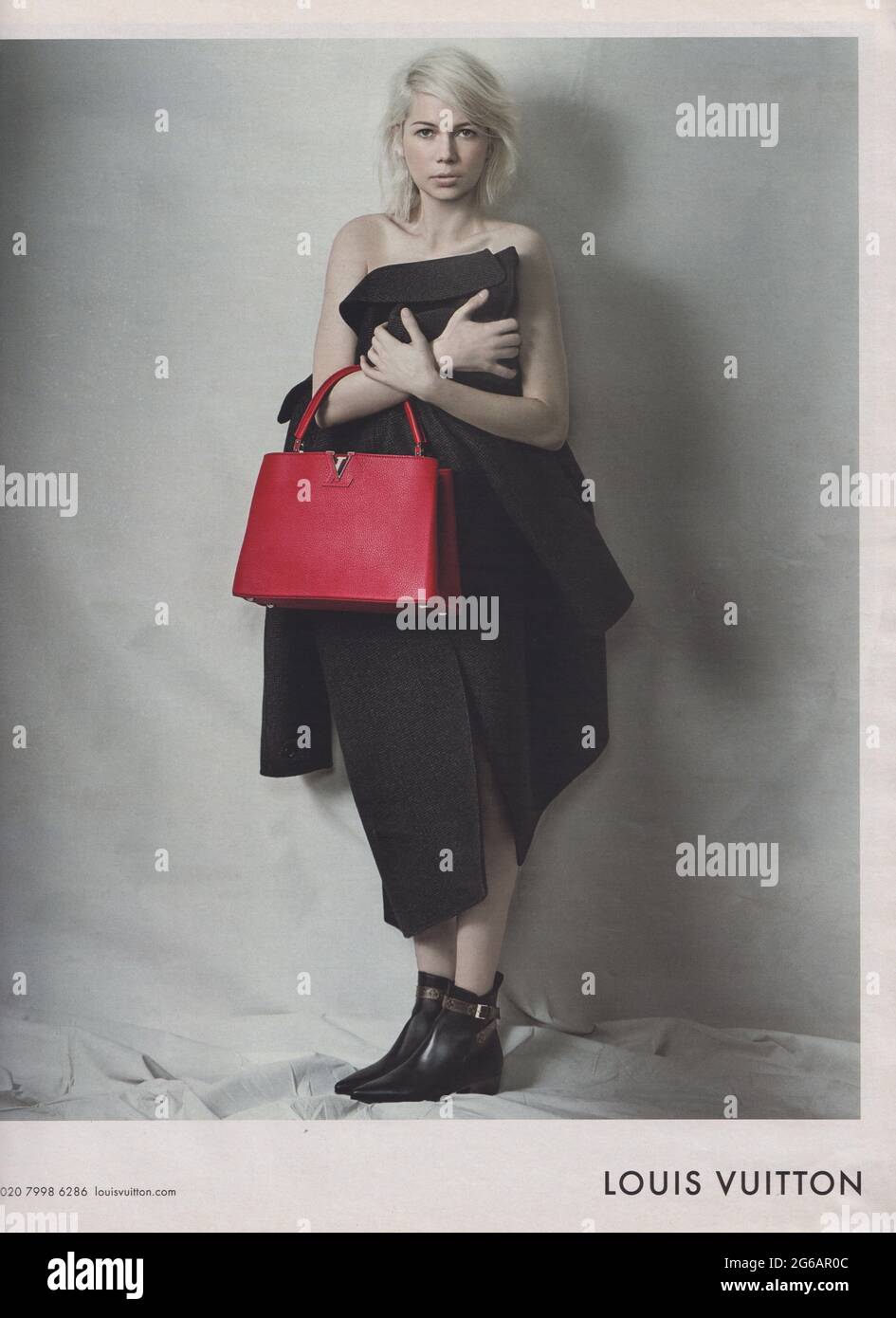 poster advertising Louis Vuitton handbag with Michelle Williams actress in paper magazine from 2015, advertisement, creative advert from 2010s Stock Photo