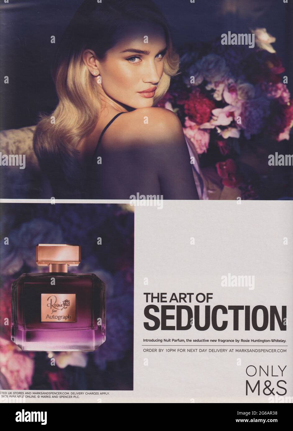 poster advertising M&S The Art of Seduction fragrance with Rosie Huntington-Whiteley, paper magazine from 2015, creative Marks & Spencer 2010s advert Stock Photo