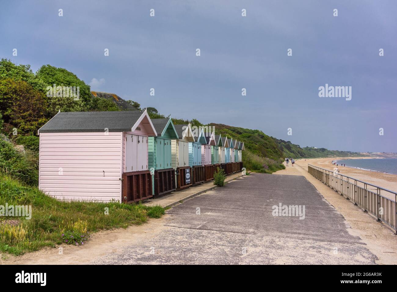 Colourful beach huts and the sea at Friars Cliff Beach in Dorset, England, UK Stock Photo