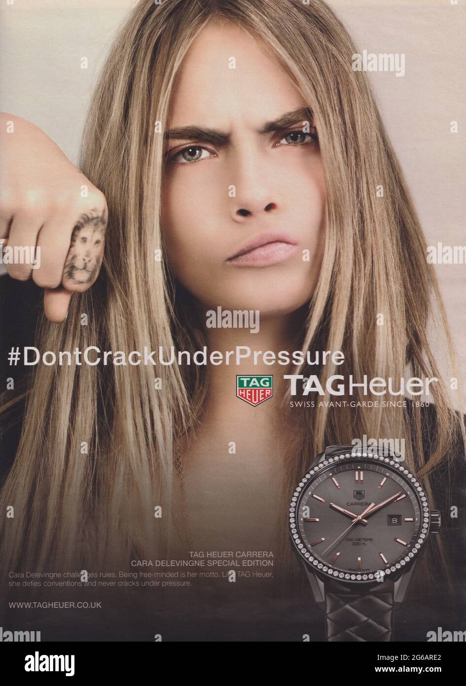 poster advertising TAG-Heuer watch with Cara Delevingne in magazine from 2015, DON'T CRACK UNDER PRESSUERE slogan, advertisement, creative advert Stock Photo