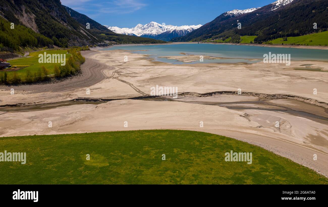 view of Lake Resia and Ortler Mountains in Val Venosta Alto Adige, Italy Stock Photo