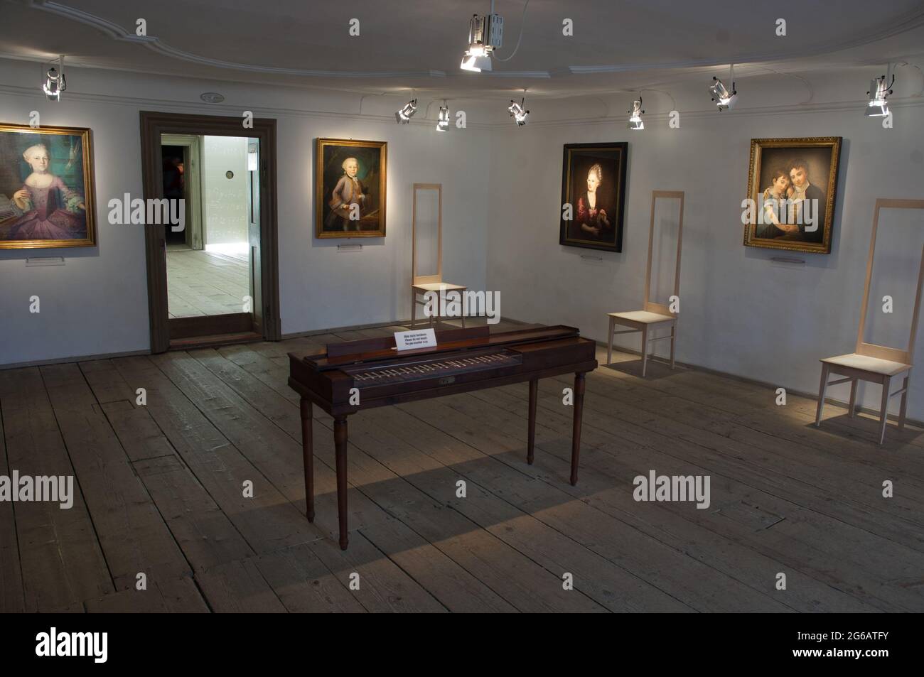 Harpsichord and paintings, Mozart Birthplace Museum Stock Photo