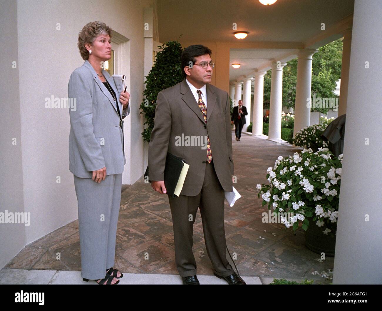 Counselor Karen Hughes and Counsel Alberto Gonzales wait on the Colonnade for President George W. Bush to arrive at the White House Tuesday, Sept. 11, 2001.  Photo by Paul Morse, The White House. Stock Photo