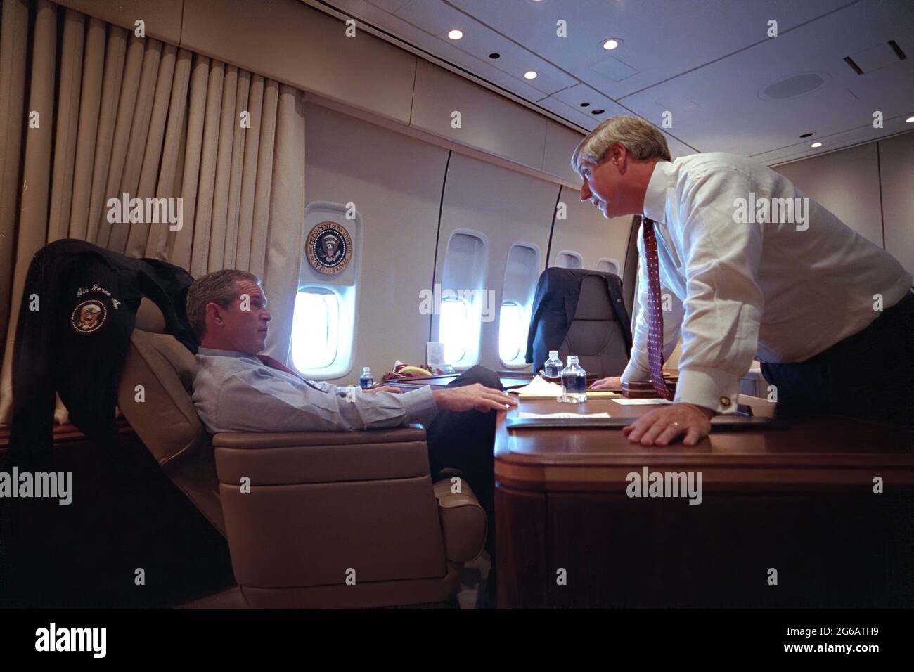 President George W. Bush speaks with White House Chief of Staff Andy Card Tuesday, Sept. 11, 2001, aboard Air Force One.  Photo by Eric Draper,The White House. Stock Photo