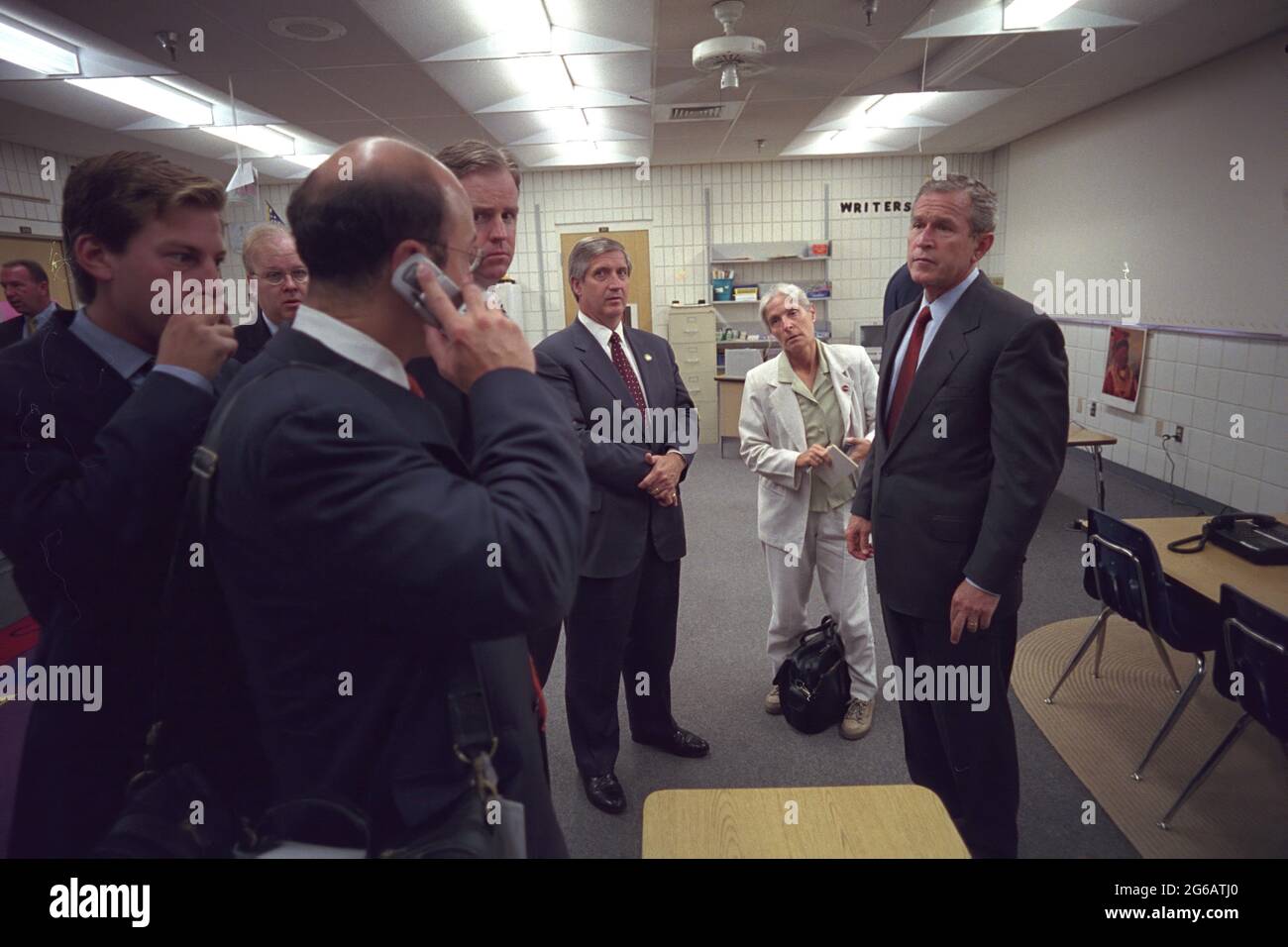 President W. Bush confers with staff members Tuesday, Spet. 11