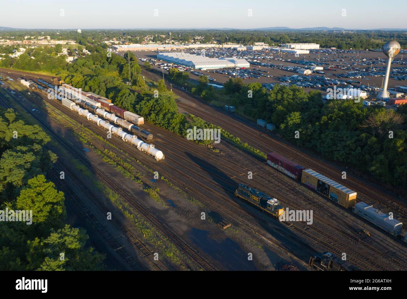 Aerial of multiple trains traveling on tracks in New Jersey Stock Photo