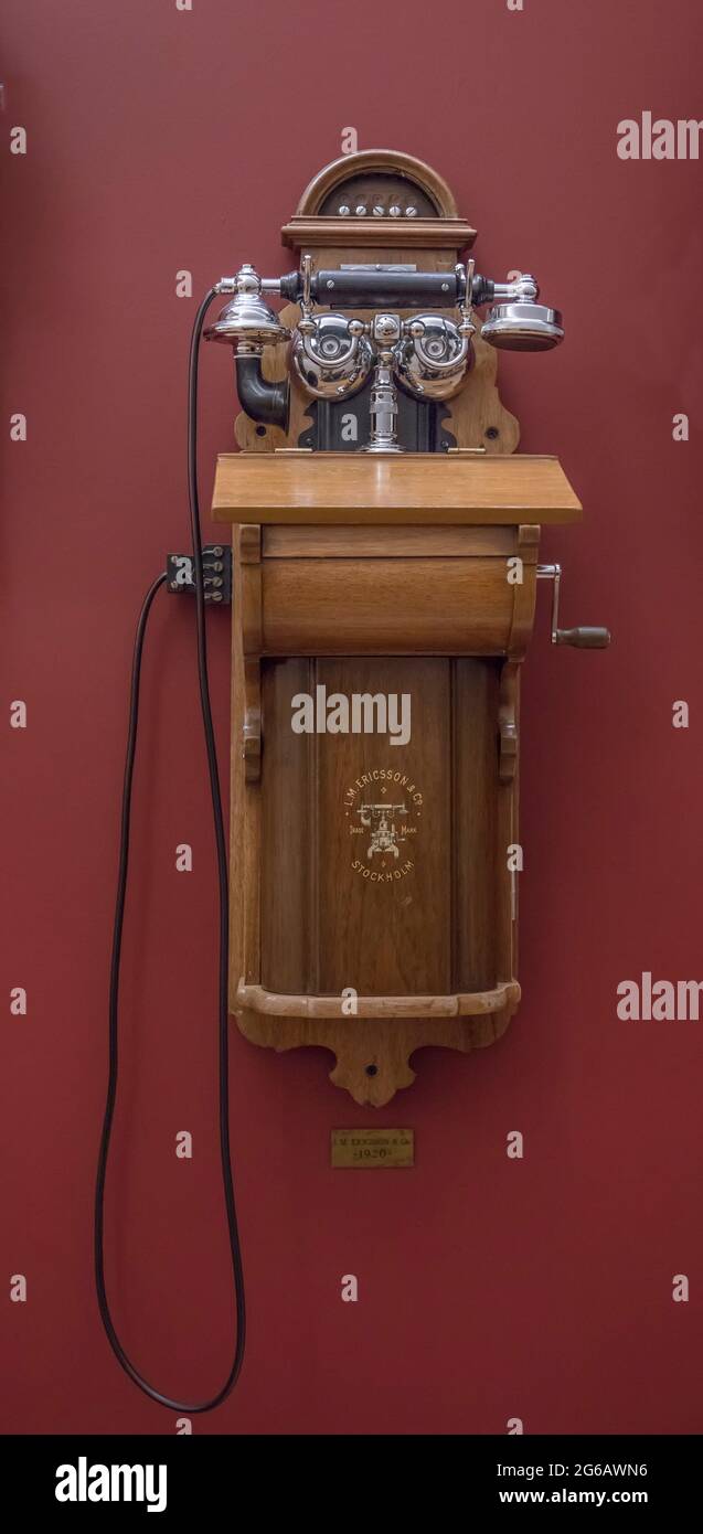 Vintage wall telephone 1920 on red background Stock Photo