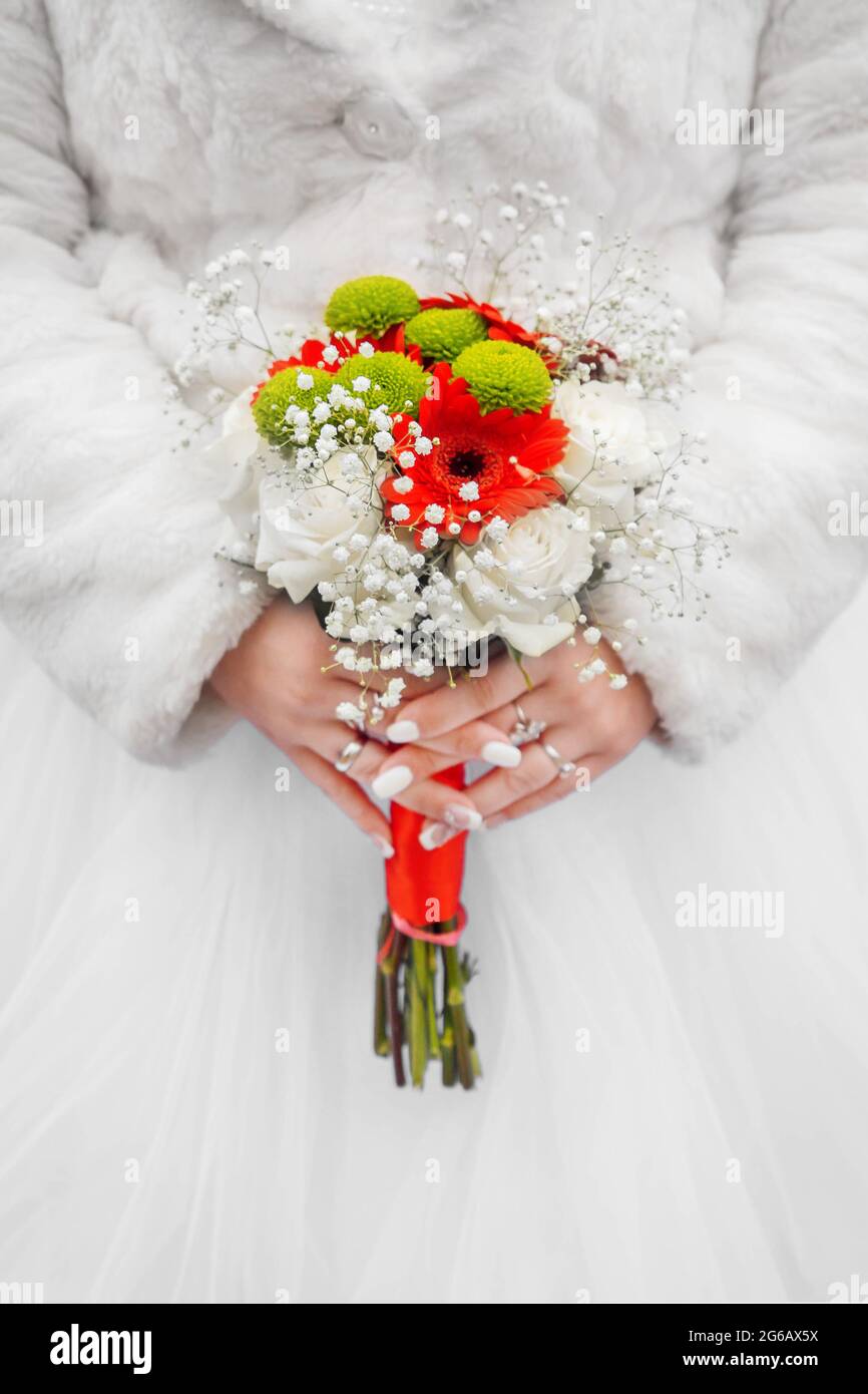 Bride in white coat and wedding dress 