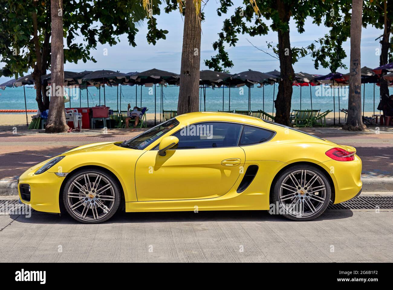 Porsche 911 Cayman GT4 yellow modern super car Stock Photo