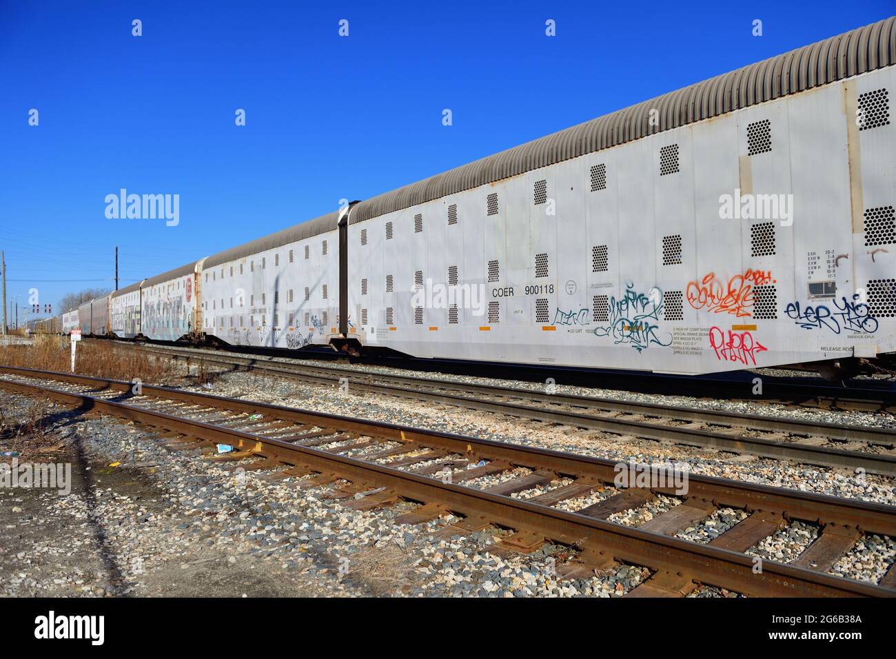 Dolton, Illinois, USA. An auto rack freight train on a busy multitrack