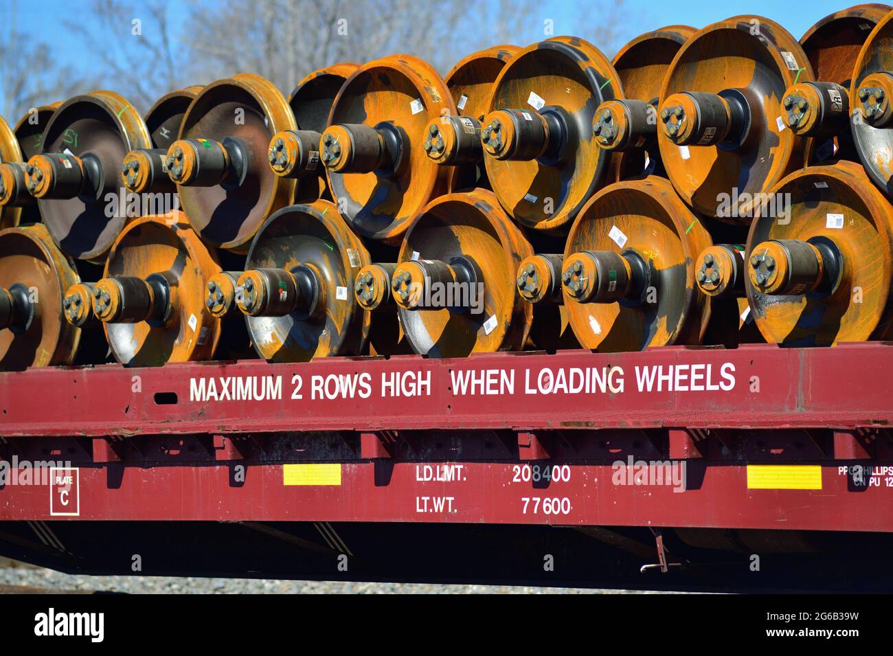 Dolton, Illinois, USA. A freight car with a double stack of car wheels appears in a freight train on a busy stretch of track in suburban Chicago. Stock Photo