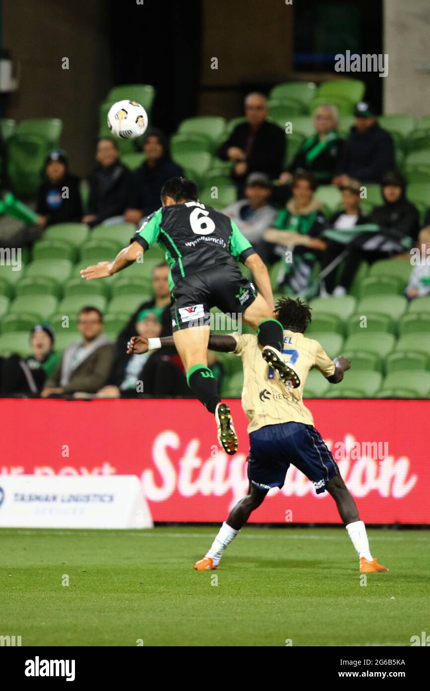 MELBOURNE, AUSTRALIA - APRIL 26: Tomoki Imai of Western United heads the ball ahead of Valentino Yuel of Newcastle Jets during the Hyundai A-League soccer match between Western United FC and Newcastle Jets on April, 26, 2021 at AAMI Park in Melbourne, Australia. (Photo by Dave Hewison) Stock Photo