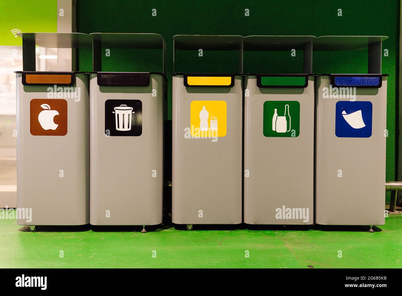 Special containers for separating garbage , standing in row. Ecology and waste separation. Environmental pollution. Social consciousness. Use of recyc Stock Photo