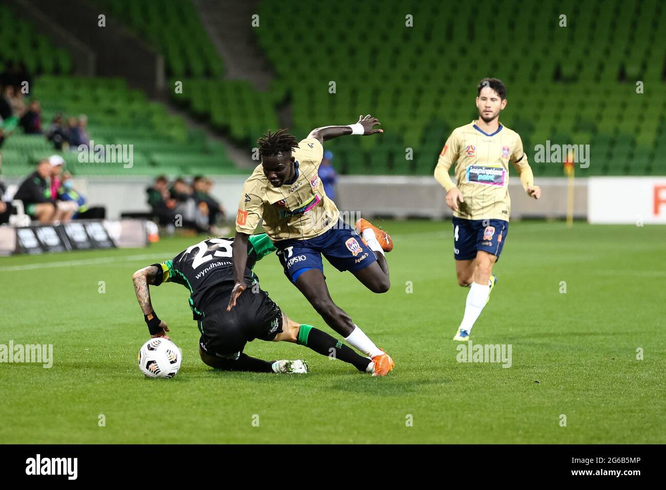 MELBOURNE, AUSTRALIA - APRIL 26: Valentino Yuel of Newcastle Jets and Alessandro Diamanti of Western United clash during the Hyundai A-League soccer match between Western United FC and Newcastle Jets on April, 26, 2021 at AAMI Park in Melbourne, Australia. (Photo by Dave Hewison) Stock Photo