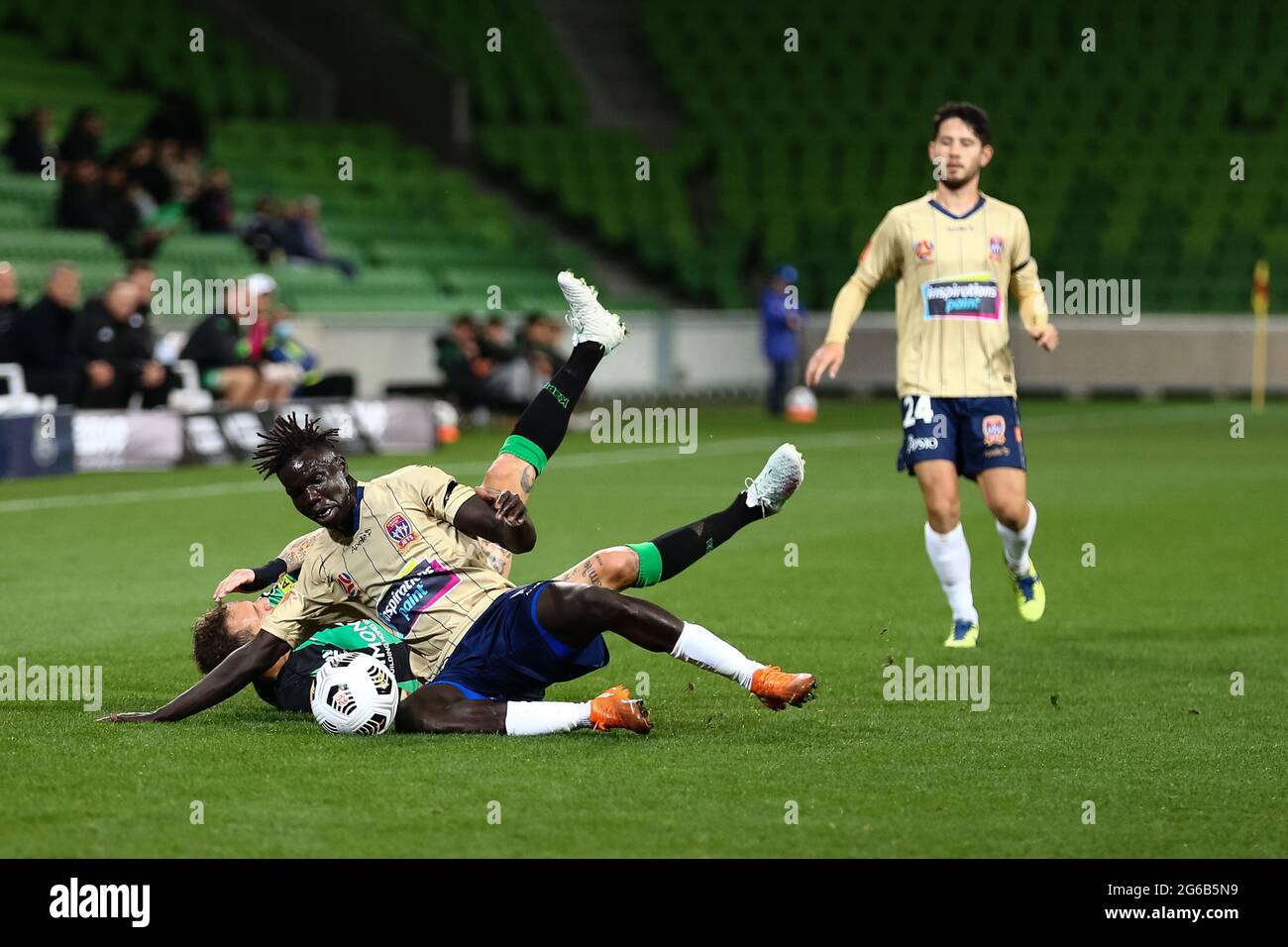 MELBOURNE, AUSTRALIA - APRIL 26: Valentino Yuel of Newcastle Jets and Alessandro Diamanti of Western United clash during the Hyundai A-League soccer match between Western United FC and Newcastle Jets on April, 26, 2021 at AAMI Park in Melbourne, Australia. (Photo by Dave Hewison) Stock Photo