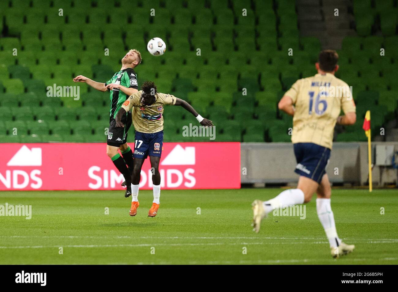 MELBOURNE, AUSTRALIA - APRIL 26: Connor Pain of Western United heads the ball ahead of Valentino Yuel of Newcastle Jets during the Hyundai A-League soccer match between Western United FC and Newcastle Jets on April, 26, 2021 at AAMI Park in Melbourne, Australia. (Photo by Dave Hewison) Stock Photo