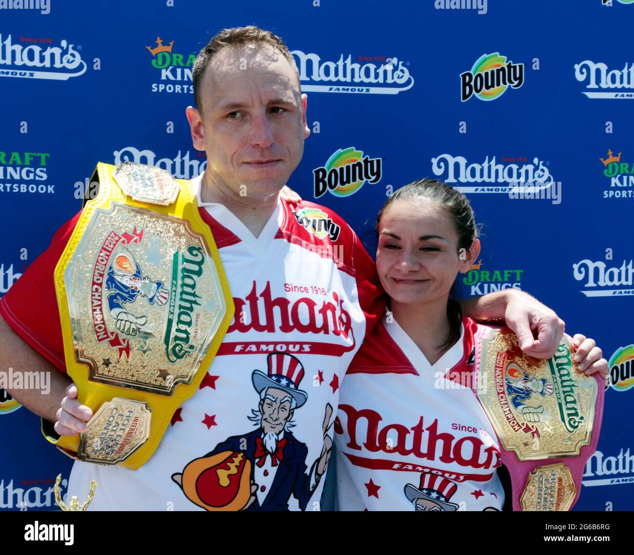 Coney Island, New York, USA. 4th July, 2021. (L-R) Joey Chestnut and Michelle Lesco win the 2021Nathan's Hot Dog Eating Competition with appearances by New York City Mayor Bill De Blasio, Brooklyn Attorney General Eric Gonzalez and others celebrating the Fourth of July on July 4, 2021 in the Coney Island section of New York City. Credit: Mpi43/Media Punch/Alamy Live News Stock Photo