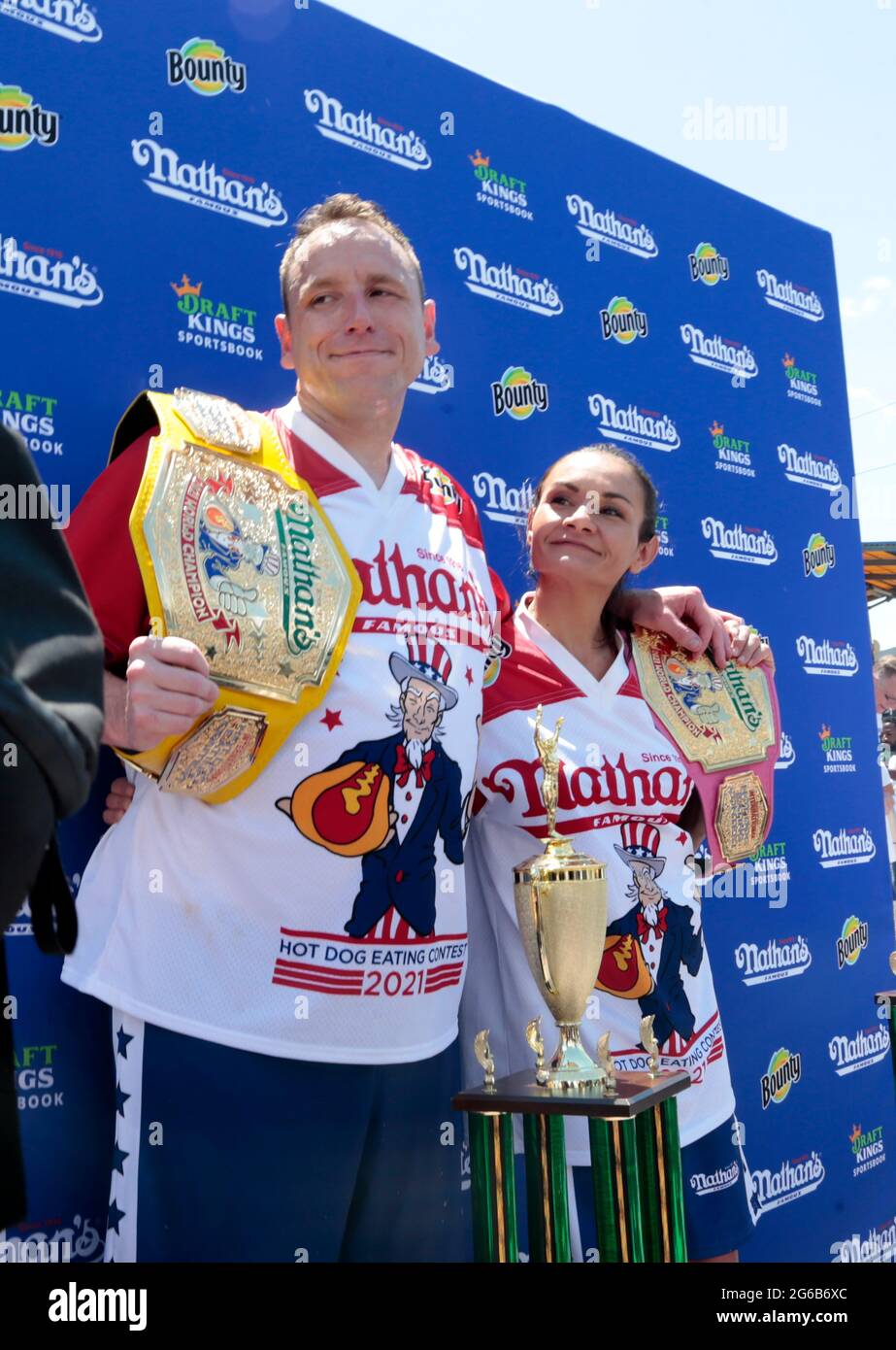 Coney Island, New York, USA. 4th July, 2021. (L-R) Joey Chestnut and Michelle Lesco win the 2021Nathan's Hot Dog Eating Competition with appearances by New York City Mayor Bill De Blasio, Brooklyn Attorney General Eric Gonzalez and others celebrating the Fourth of July on July 4, 2021 in the Coney Island section of New York City. Credit: Mpi43/Media Punch/Alamy Live News Stock Photo