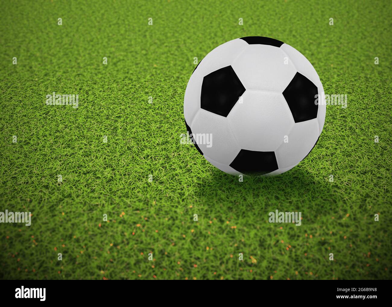 Digitally rendered soccer or football ball lying on the green grass, 3d ...