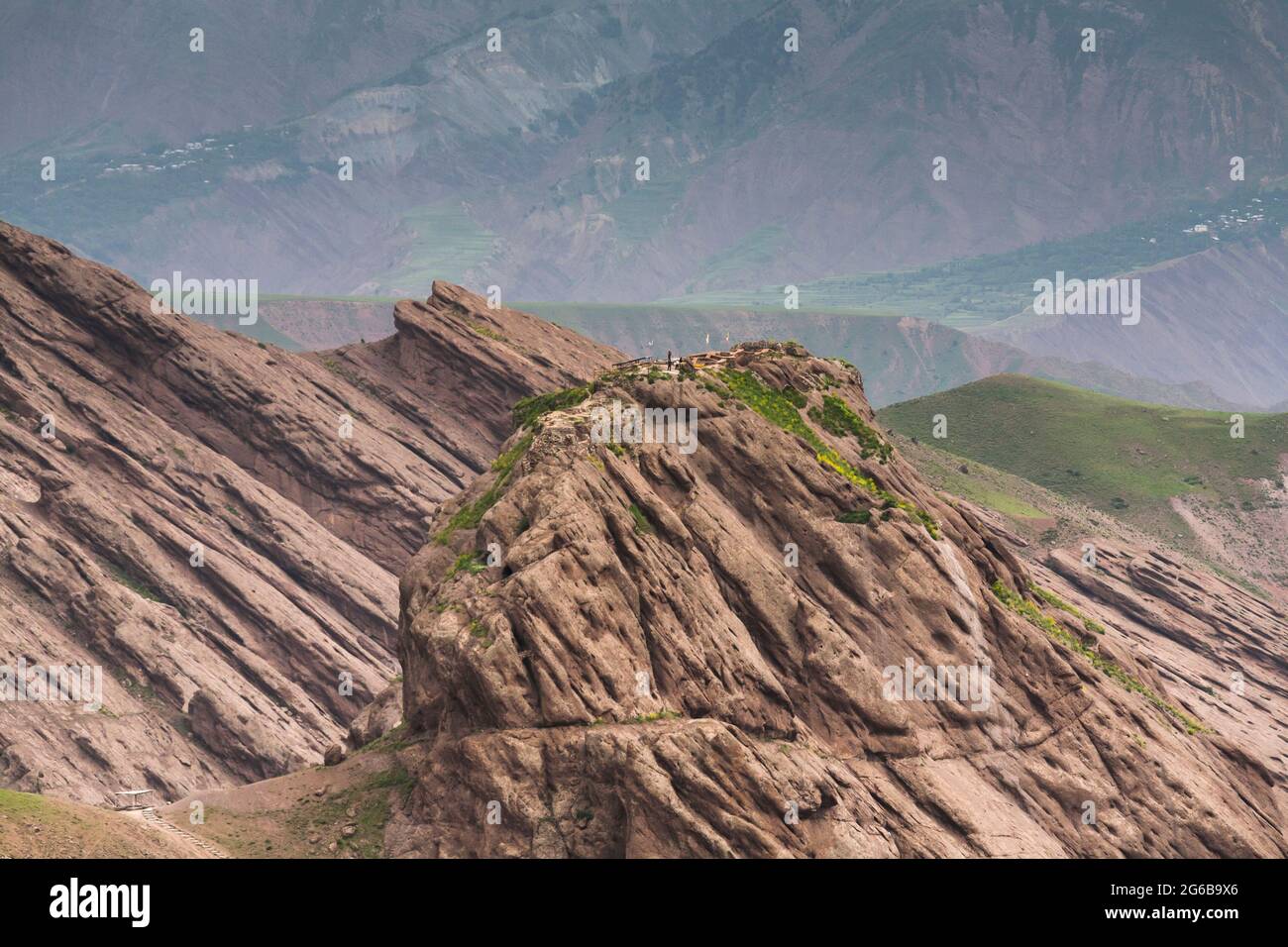 Distant view of Alamut Castle(fort), on steep hilltop, and Alborz mountains, Alamut, Qazvin Province, Iran, Persia, Western Asia, Asia Stock Photo
