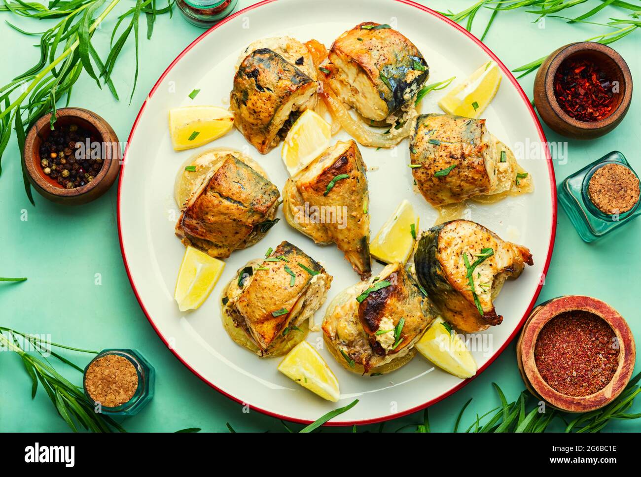 Baked mackerel with onions,tarragon herbs and spice Stock Photo Alamy