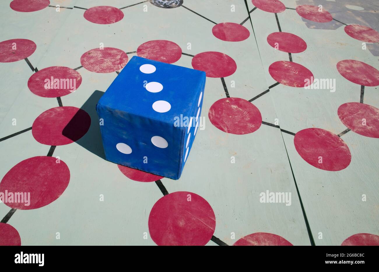 large dice on game board outdoors Stock Photo Alamy