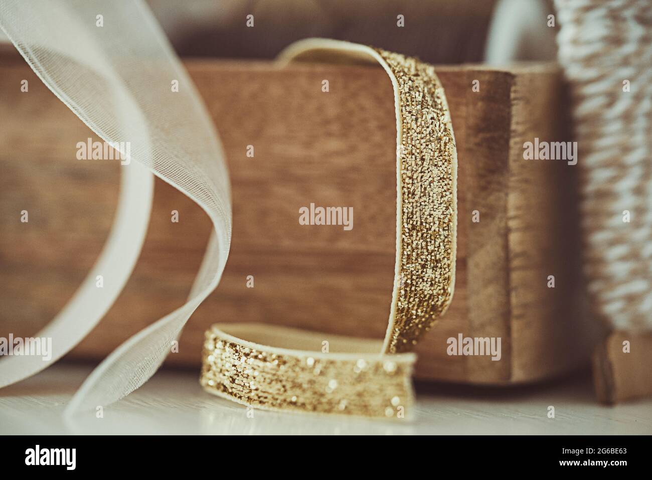 Close-up of ribbons in a wooden box on a table Stock Photo