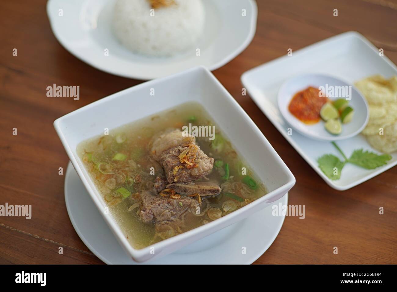 Delicious Traditional Food with Cow Tail Boiled with Spices. Indonesian Oxtail Soup. Stock Photo